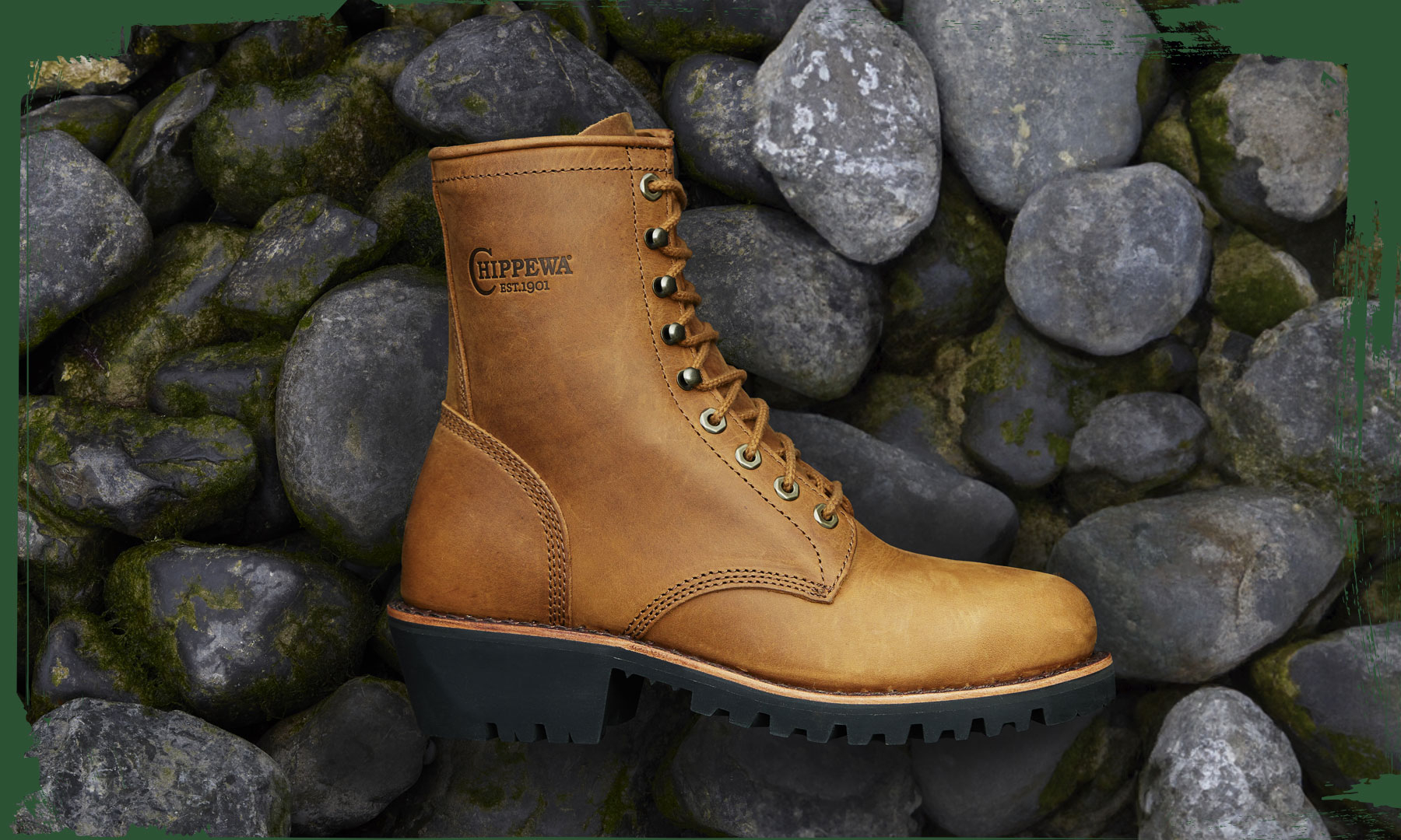 The Classic 2.0 8" Bourbon Brown Steel Toe Logger Limited Edition in bourbon brown on a bed of river stone.