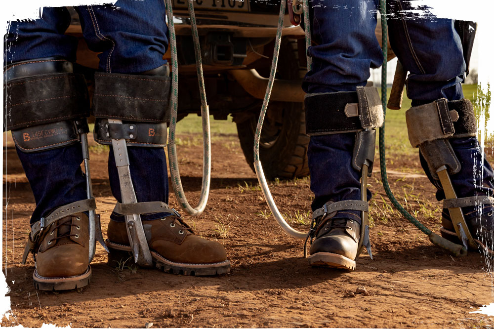 A man wearing the The Super Dna 9" Waterproof Steel Toe Logger in brown sanding next to a man wearing the Baldor 8" Steel Toe Logger in black.