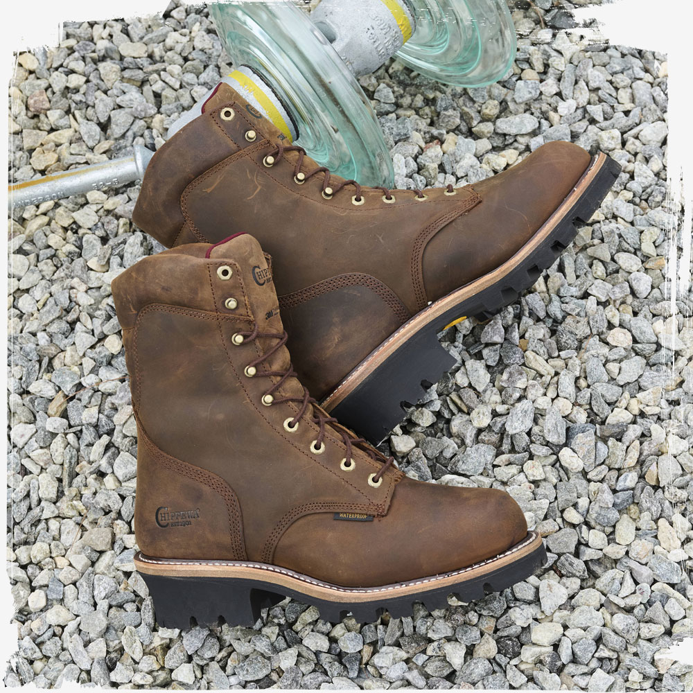 The Super Dna 9" Waterproof Steel Toe Insulated Logger in Bay Apache (brown) lying on gravel.