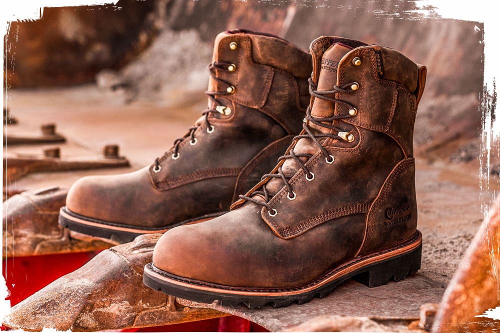 The Chippewa Super Dna 8" Waterproof Steel Toe Insulated work boot in Bay Apache brown sitting in a backhoe bucket.
