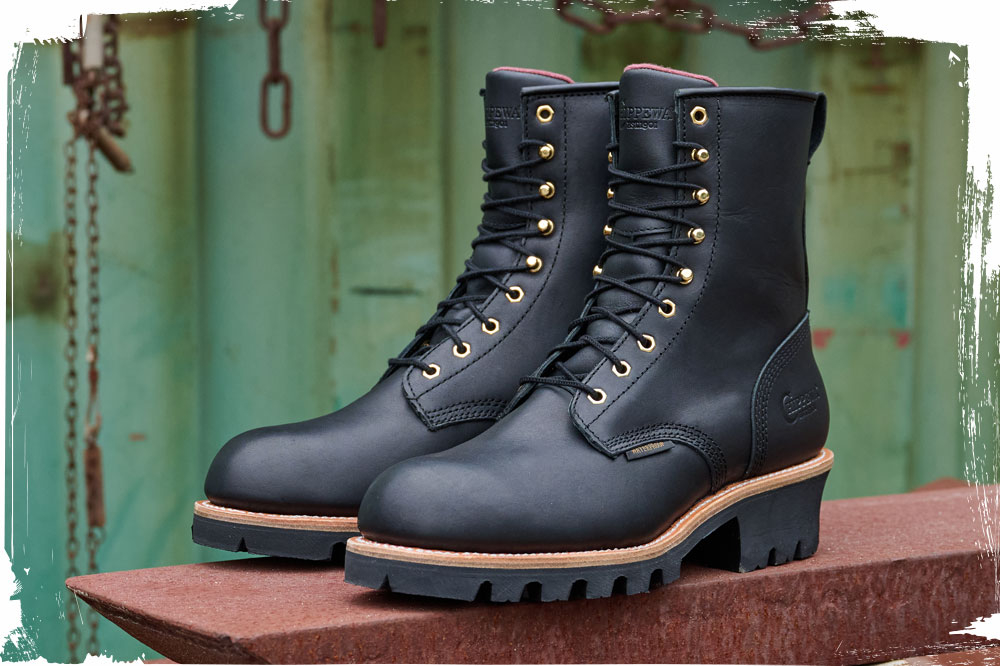 The Super Dna 6" Waterproof Lace-Up logger in charcoal (black) sitting on a rusty beam.