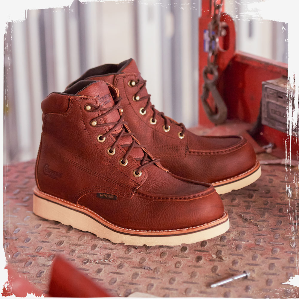 The Edge Walker 6" Waterproof Lace Up Wedge in  Briar Haystack (Brown) on a metal table.