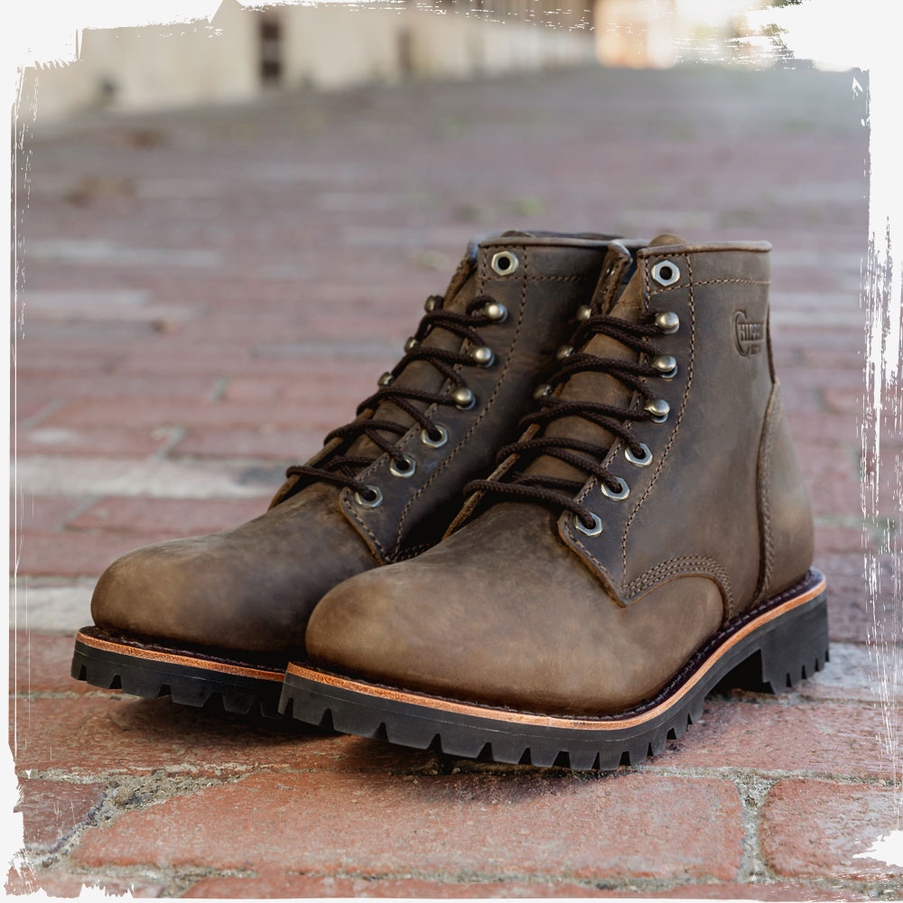 The Classic 2.0 6" Lace Up in Apache Brown on a brick walkway.