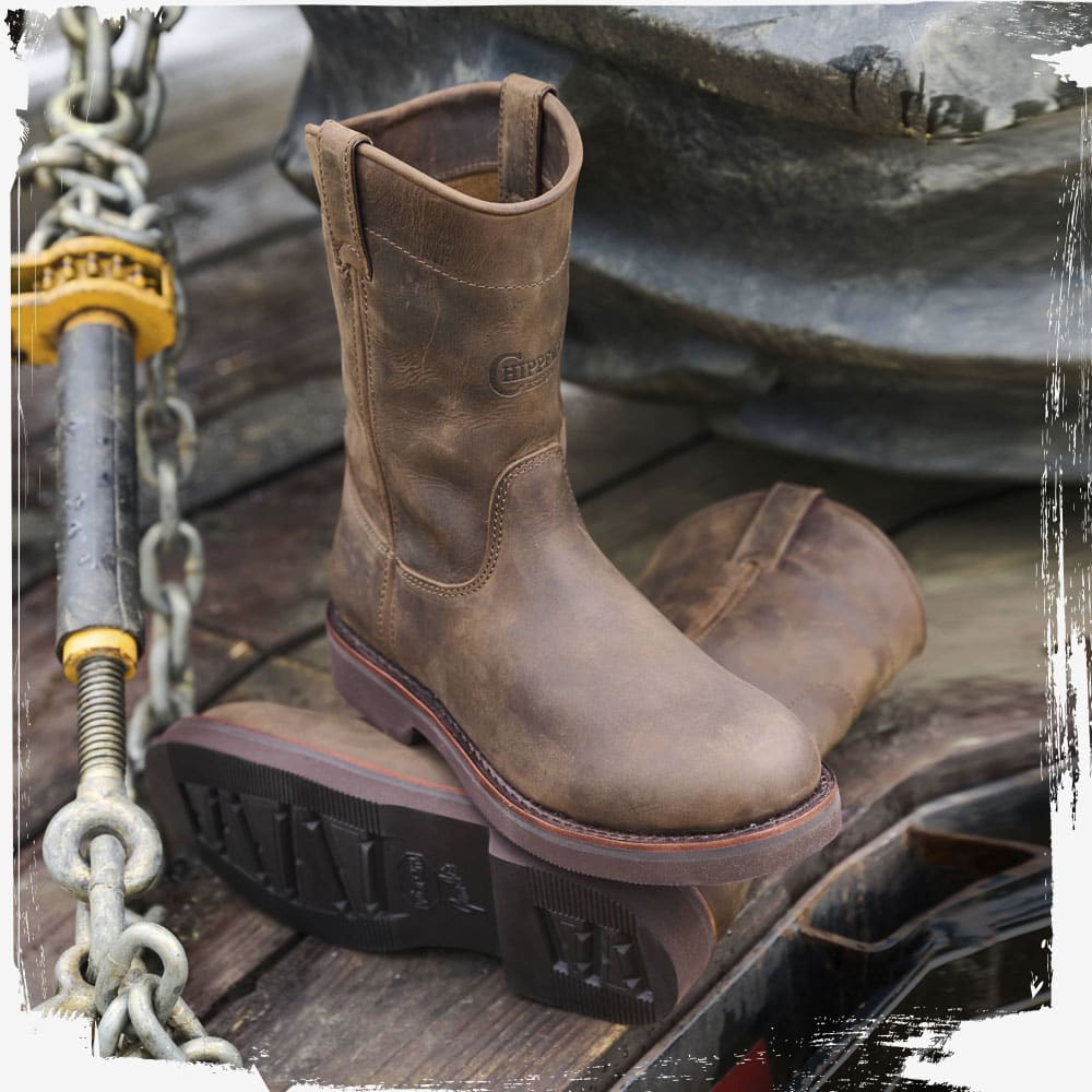 The Classic 2.0 10" Pull On in Chocolate Apache (Brown) on a bed of a truck.