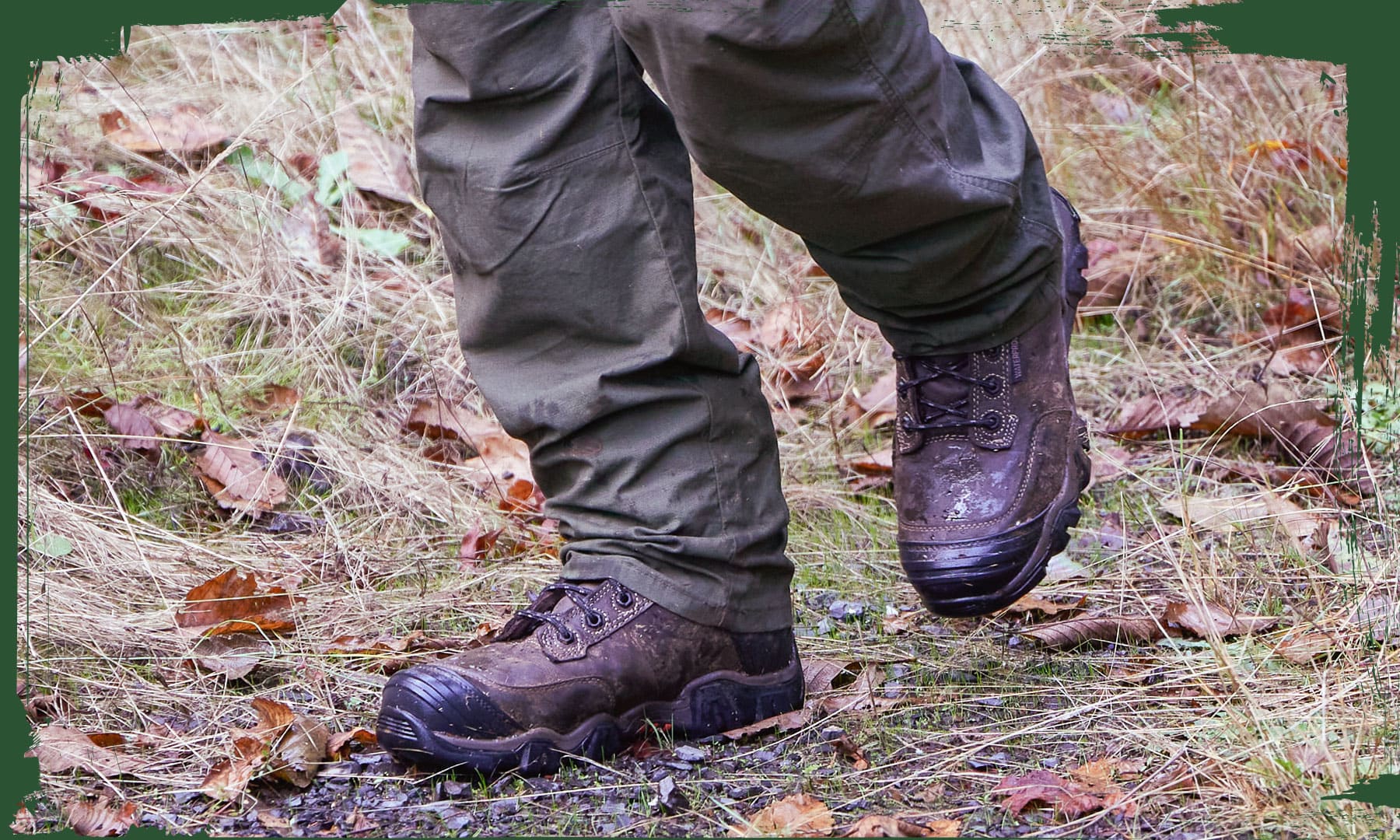 A man wearing the Cross Terrain 8" Waterproof Insulated Nano Comp Toe Hiker in Graphite (grey) while hiking on a trail.