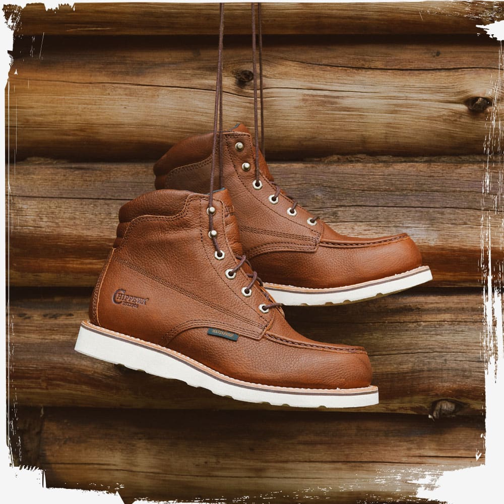The Edge Walker 6" Waterproof Lace Up Wedge in Briar Haystack (Brown) hanging in a cabin.