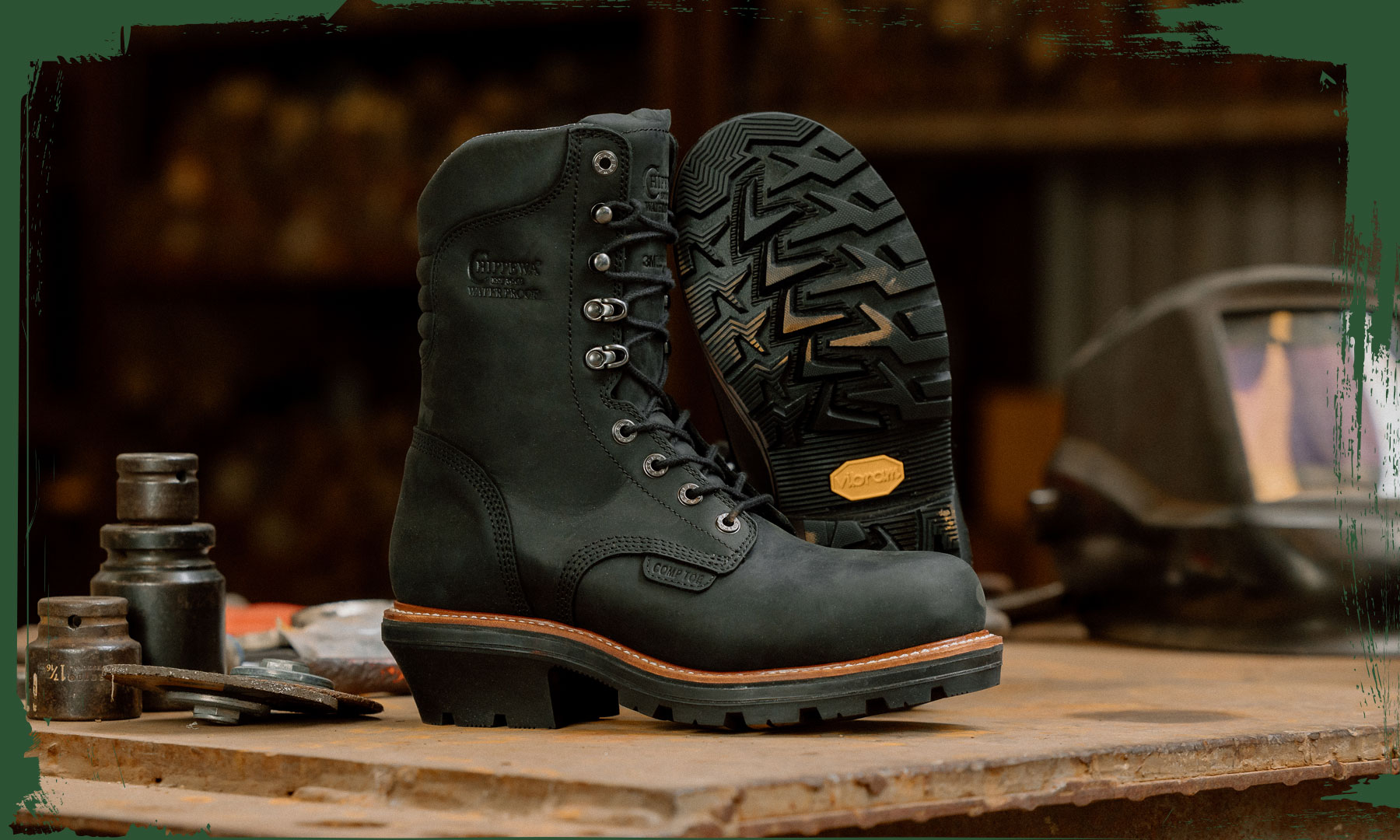 The Thunderstruck 9" Insulated Waterproof Nano Comp Toe Logger in charcoal black on a work bench.