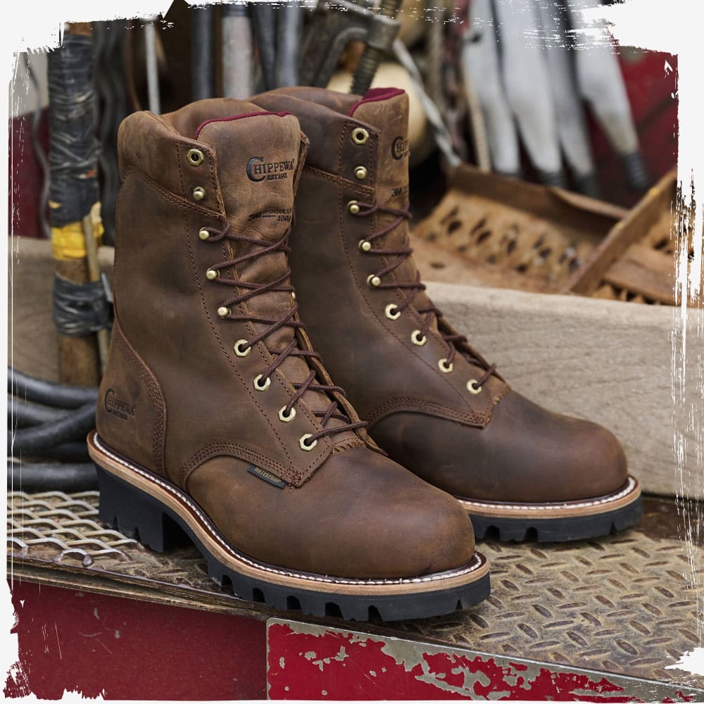 The Super Dna 9" Waterproof Steel Toe Insulated Logger in Bay Apache (brown) on the back of a truck.