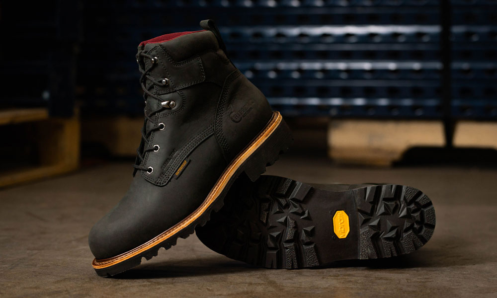 The Super Dna 6" Waterproof Steel Toe Lace-Up in black sitting on concrete.
