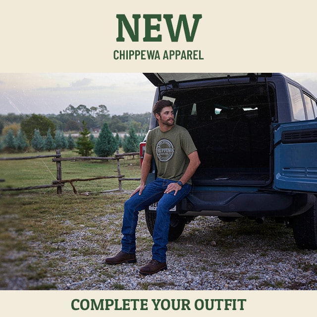 New! Chippewa apparel. Complete your outfit. Man sitting in a truck wearing wood log tee in olive. Shop Men's Apparel.